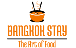 Silhouette of a steaming bowl of traditional Thai soup in orange tones.